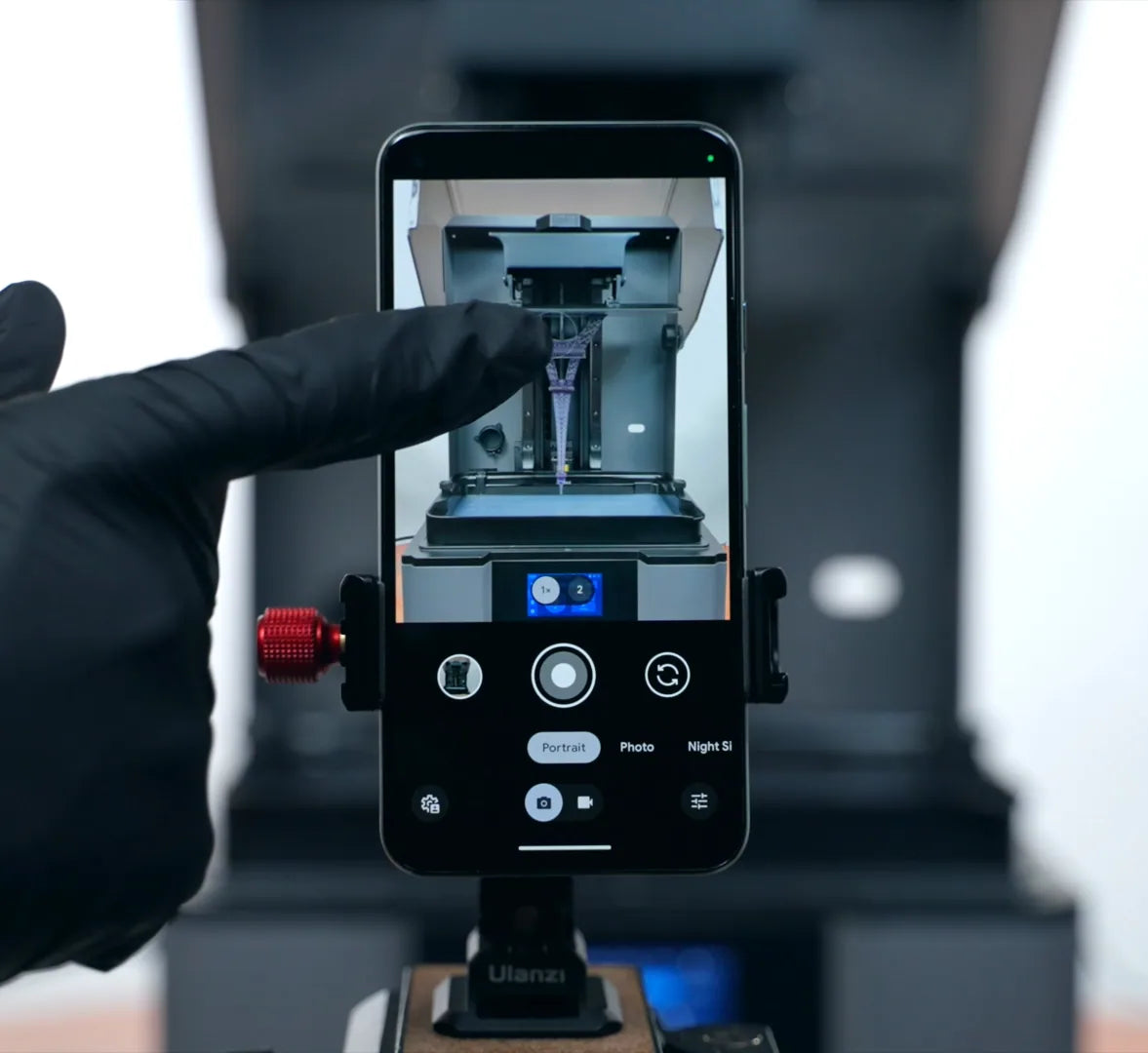 Smartphone recording a resin 3D print timelapse using the SyncUV Hub