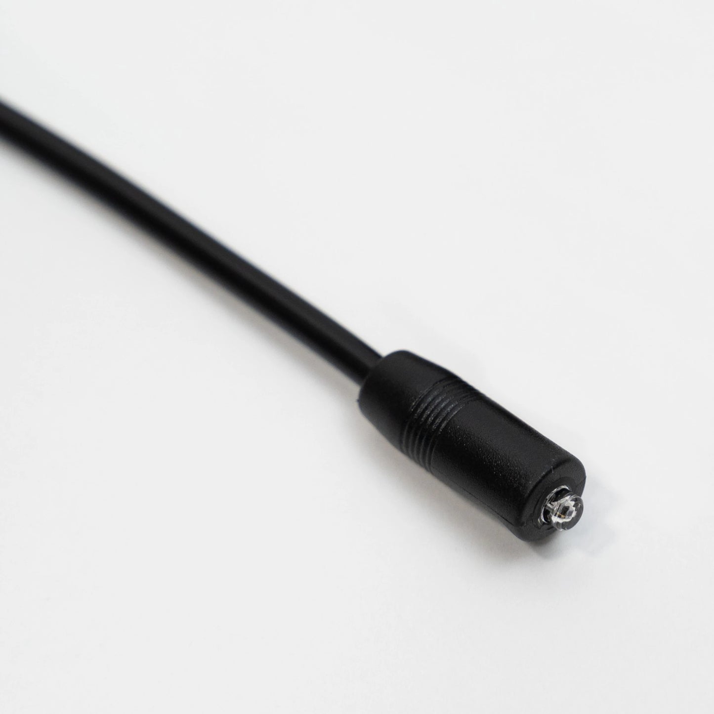 Close-up of the SyncUV Sensor in molded black cable.
