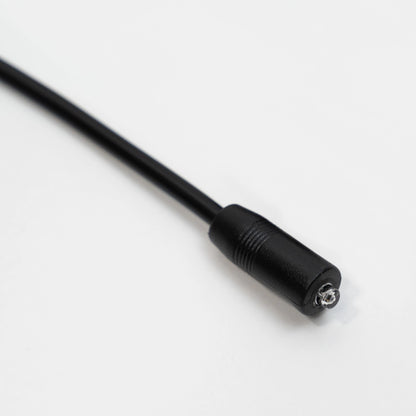 Close-up of the SyncUV Sensor in molded black cable.